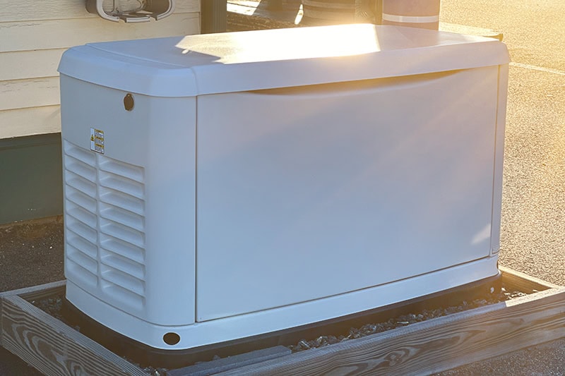 Generator Demand Pops in U.S.: What’s Driving the Surge? A Home Standby Generator installed at the backyard of a house. An air-cooled Generator powered by natural gas or liquid propane for residential use.